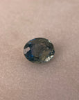Blue gemstone on a beige background