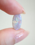 1.55ct Lightning Ridge Australian Opal in hand for scale.