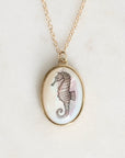Necklace with a seahorse pendant on a light background