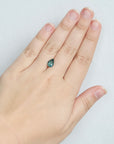 Green pear shaped sapphire on hand
