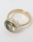 watery moss aquamarine ring set in gold with silver barnacles