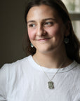 woman wearing necklace