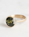 green gemstone ring with barnacles
