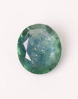 Green gemstone on a white background