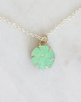 Necklace with a green pendant on a white background