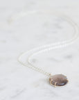 Necklace with a pendant on a white background