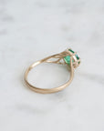 Green gemstone ring in gold branchy prongs