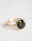 green gemstone ring with barnacles