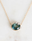 Sapphire necklace pendant with platinum barnacle details
