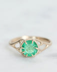 Green gemstone ring in gold branchy prongs