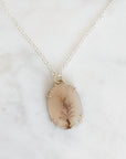Necklace with a pendant on a marble background