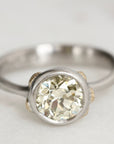 Platinum Ring with Gold Barnacles and a yellow diamond on a white background