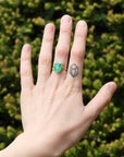 Large green gemstone ring on hand