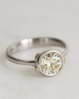 Platinum Ring with Gold Barnacles and a yellow diamond on a white background