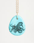 Necklace with a pendant featuring an octopus design on a light blue background