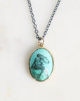 Necklace with a mermaid pendant on a light background