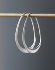 Silver facet hoops by Hannah Blount