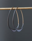 blackened silver hoops with gold ear wires