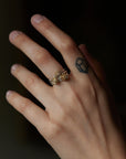 three gold and silver rose rings on person