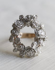 wreath of silver flowers with gold band