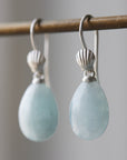 teardrops of pale, icy aquamarine hang beneath little silver scallop shell ear wires