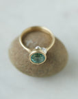 Tourmaline in yellow gold bezel setting with hand-carved barnacles