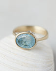 Aquamarine yellow gold bezel ring with hand-carve barnacles
