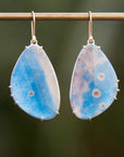 Blue pansy butterfly paraiba in quartz earrings with prongs by hannah blount jewelry