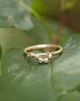 Caterpillar and diamond 14k gold ring on leaf by hannah blount jewelry