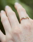 Caterpillar and diamond 14k gold ring on hand by hannah blount jewelry