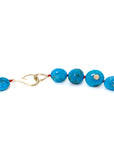 detail of kingman Turquoise beaded necklace with red silk by hannah blount