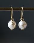 Pearl earrings with gold barnacles by Hannah Blount