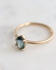 0.66ct Montana Sapphire Vanity Ring set in 14k gold with four prongs. The stone is an ocean blue.