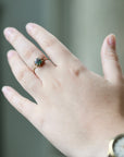 green agate stone set in gold branch ring shown on middle finger