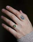 green montana sapphire ring on person