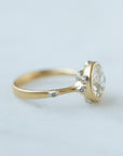 Diamond ring with gold bezel setting and white gold barnacles. THe barnacles have diamonds in them. Side profile.
