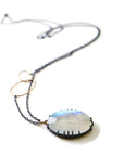 rainbow moonstone necklace with oxidized silver prongs by hannah blount