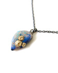 Raw opal with gold barnacles by Hannah Blount