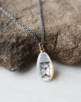 Mother-of-pearl Scrimshaw hourglass necklace by Hannah Blount