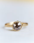 A 1.38ct diamond ring. The diamond has a chestnut hue and is set in 18k gold with an 18k gold band. The setting is encrusted with 14k gold barnacles. The ring is viewed from the front and is set on a white background.