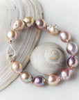 Pink freshwater pearl bracelet with silver barnacles and fish hook clasp by Hannah Blount