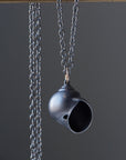 Oxidized silver moon snail shell necklace by Hannah Blount