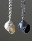 Silver moon snail shell necklace by Hannah Blount