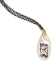 Mother-of-pearl Scrimshaw hourglass necklace by Hannah Blount