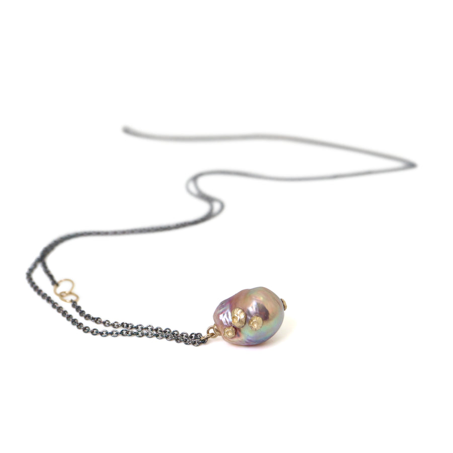 pink freshwater baroque pearl necklace with gold barnacles and black oxidized silver chain by hannah blount jewelry