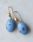 mottled blue common opal oval drops set as earrings with ear wires featuring gold Lady faces