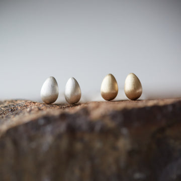 Silver and gold egg studs by Hannah Blount