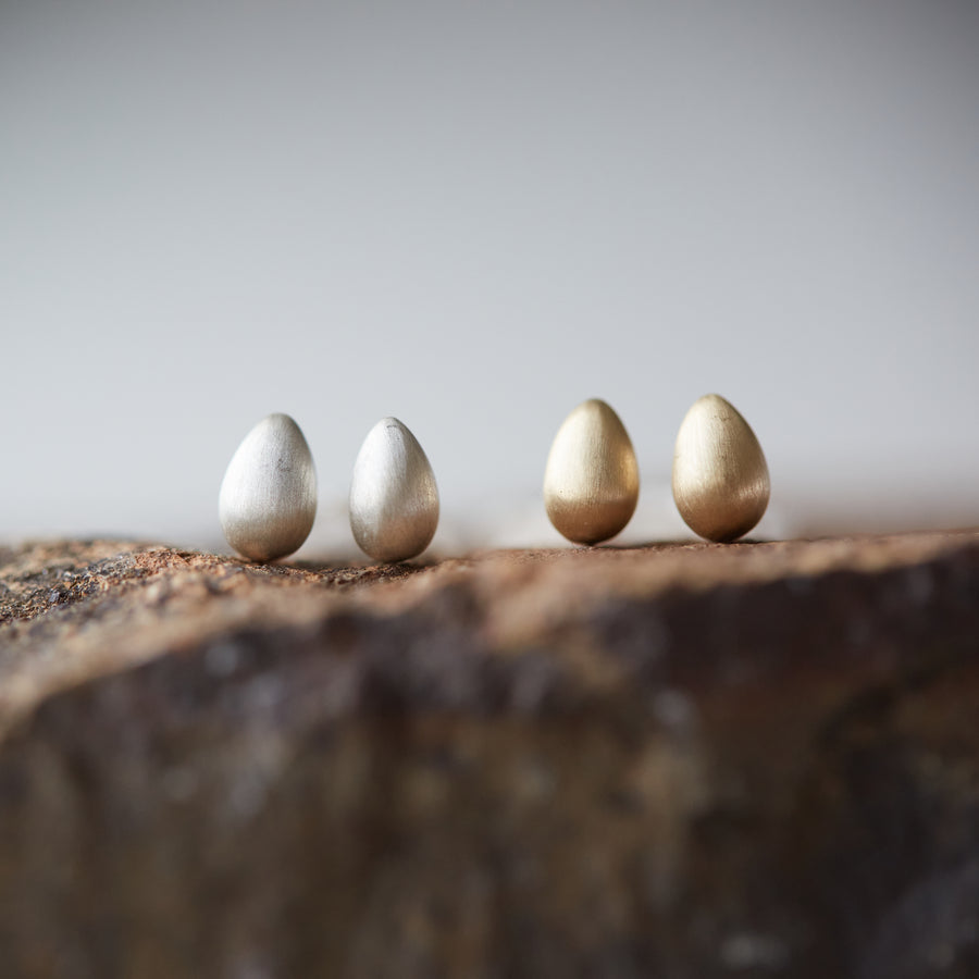 Silver and gold egg studs by Hannah Blount