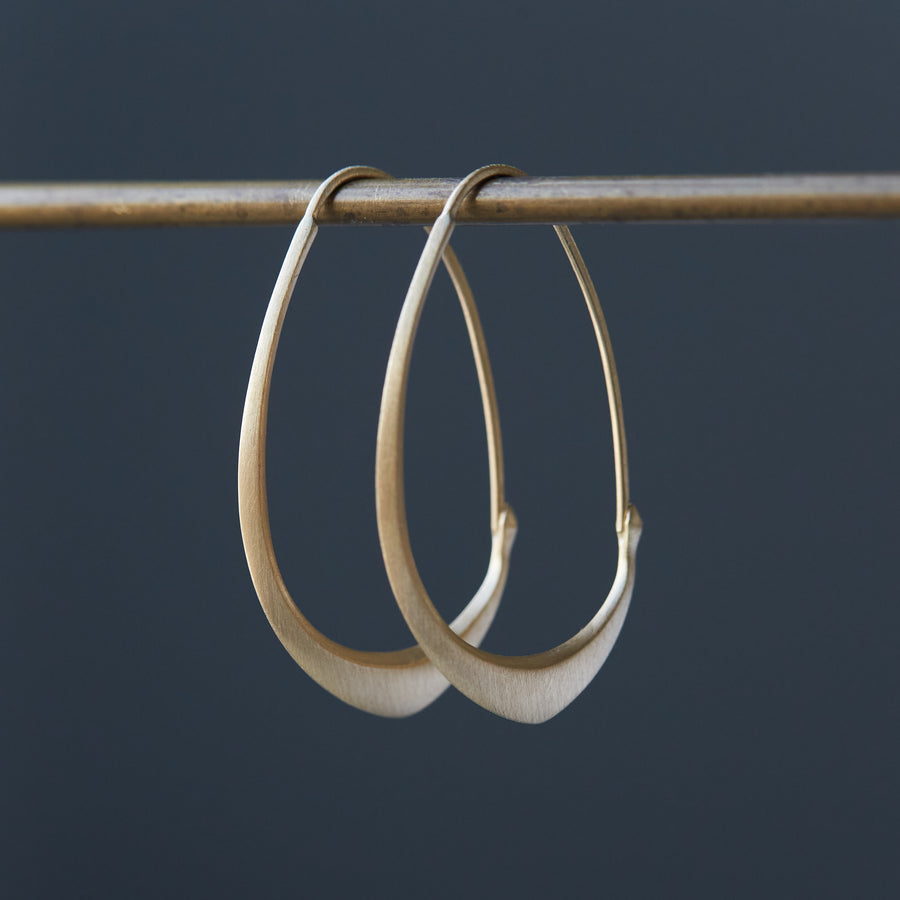 Gold facet hoops by Hannah Blount