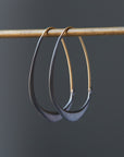 Silver and gold facet hoops by Hannah Blount